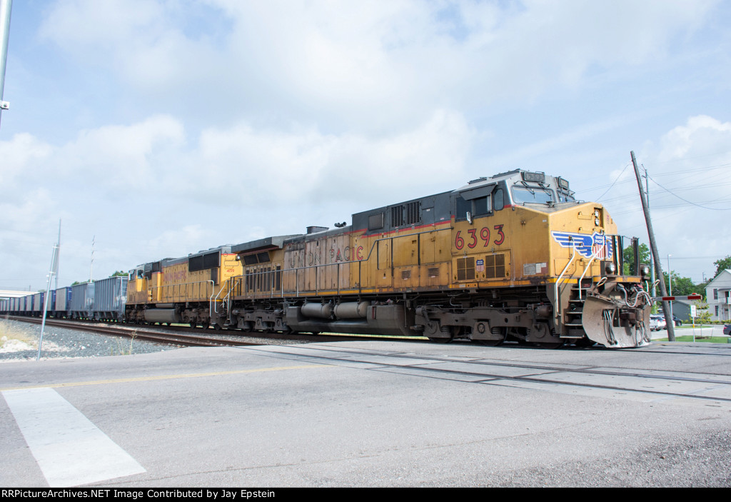 UP 6393 and UP 4159 bring up the rear of an empty stone train 